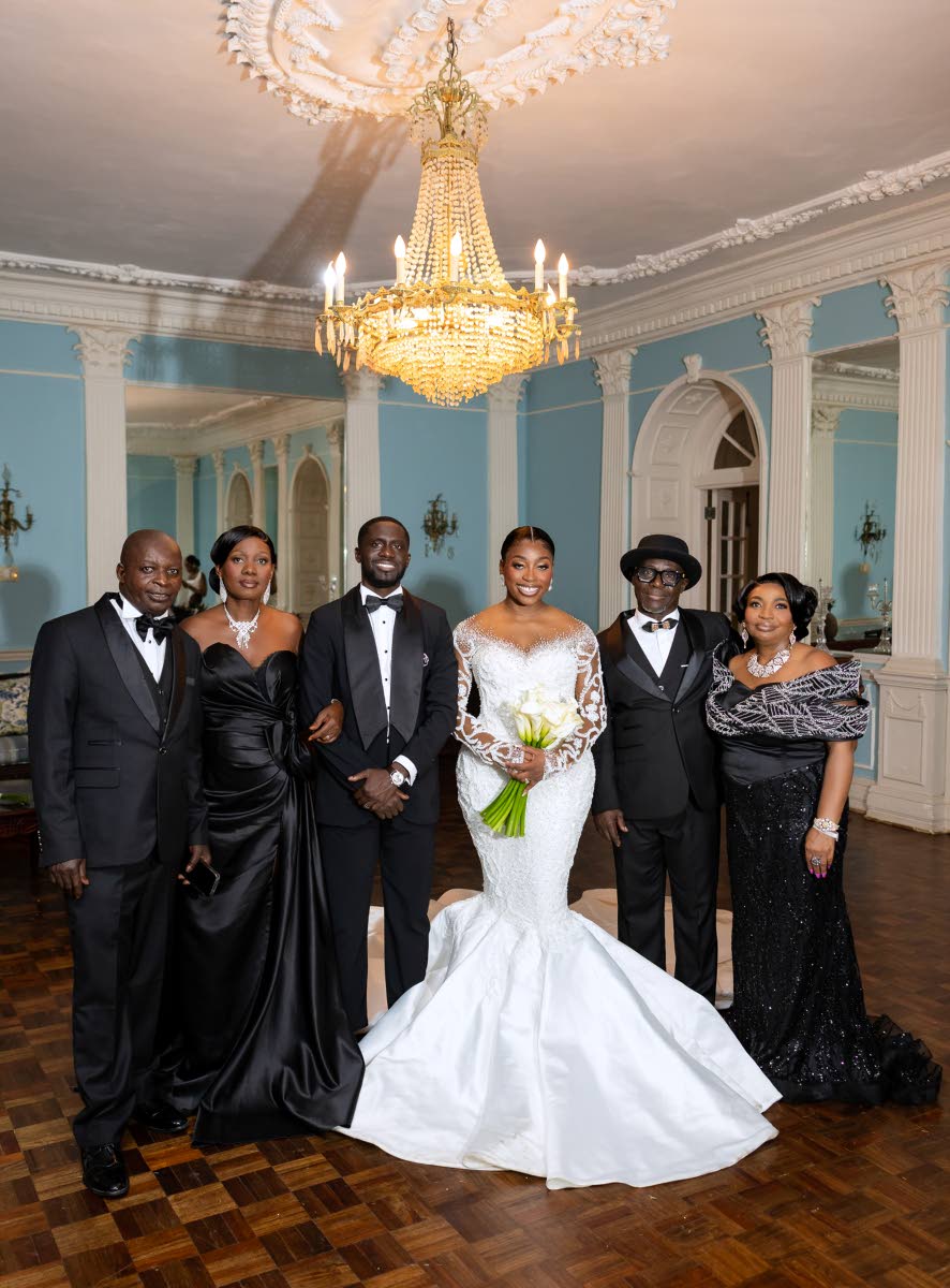 The newly-weds (centre) and their parents (from left) Nicholas Nuamah Sr, Christiana Nuamah, Peter Adu and Juliana Adusei.