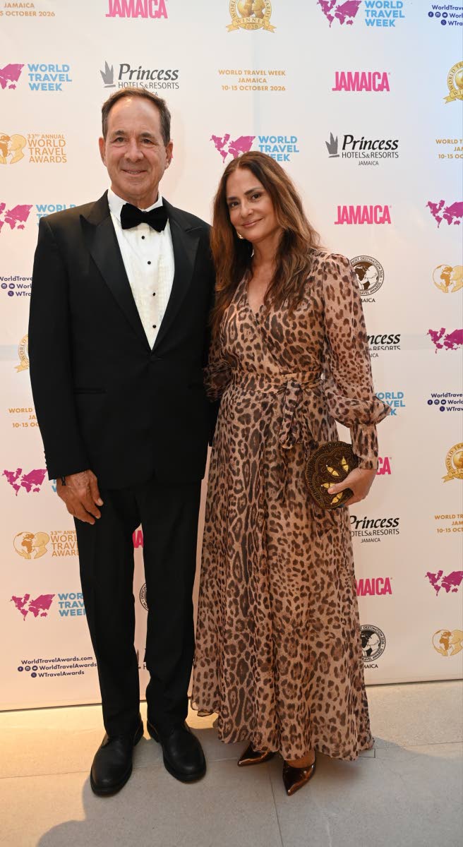 All smiles for the lens, S Hotels Jamaica chief executive officer Christopher Issa cosies up with his wife, Kimberly.