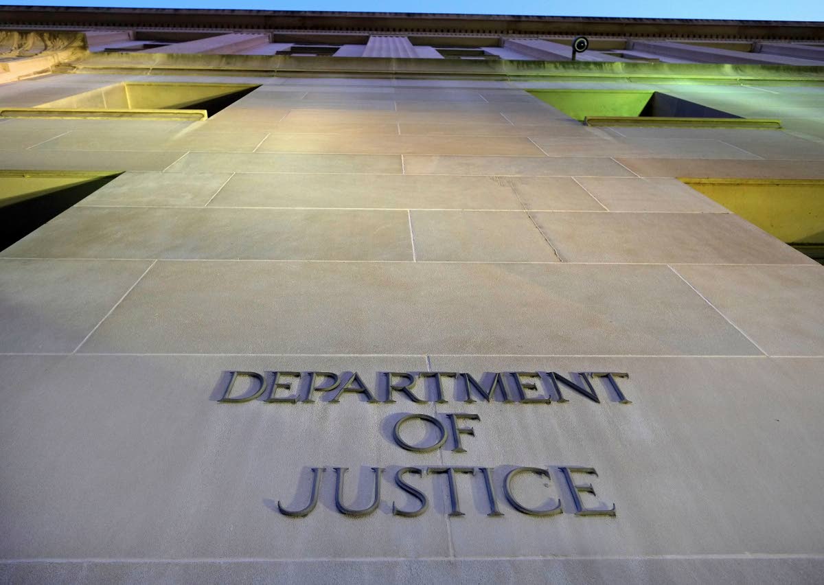 FILE - Tthe Department of Justice headquarters building in Washington is photographed early in the morning, May 14, 2013. (AP Photo/J. David Ake, File)