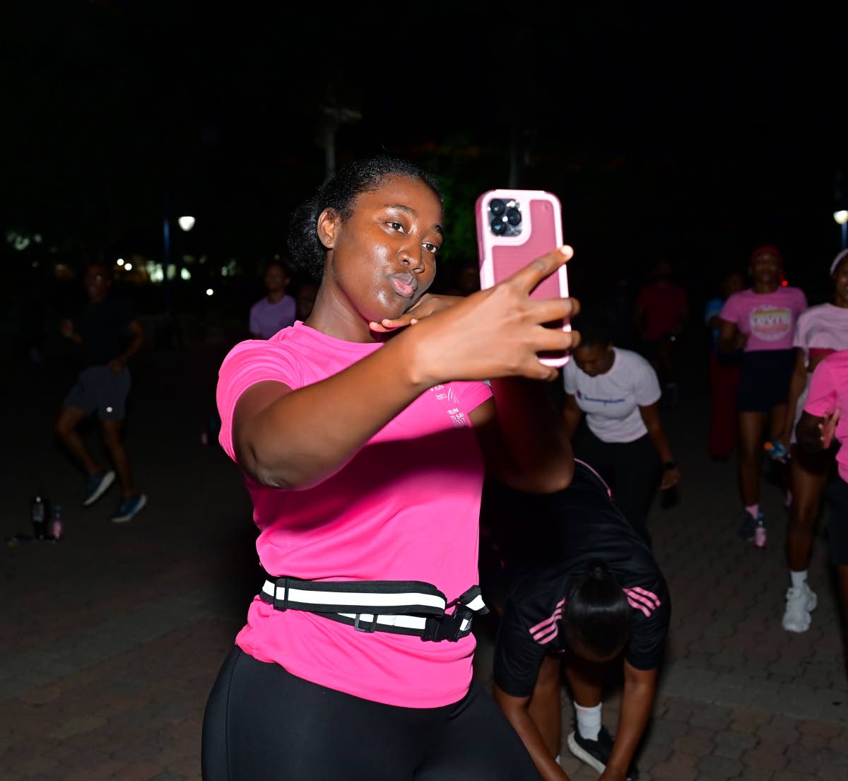 Chrison Bailey adds a pink-perfect selfie to her camera roll.