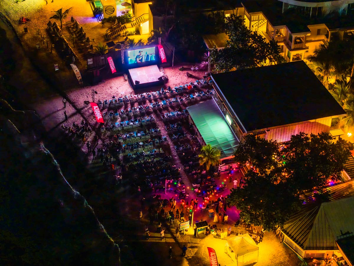 An aerial view of filmgoers watching the ‘Reggae Girlz’ documentary, co-directed by Sharmeen Obaid-Chinoy and Trish Dalton on the sands of Skylark Negril Beach Resort last Saturday night. 