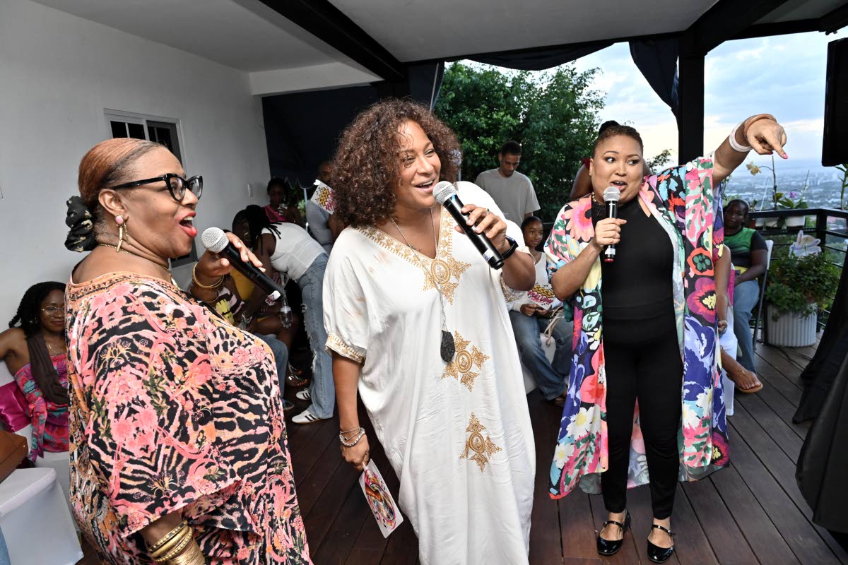 Singing for a cause! Velia Espeut (left), Dr Saphire Longmore (centre), and Anna-Maria Toby take to the microphone during Anna’s Kicking Ass Karaoke Fundraiser at Tavistock Terrace in Jack’s Hill, St Andrew, on Sunday, October 11.