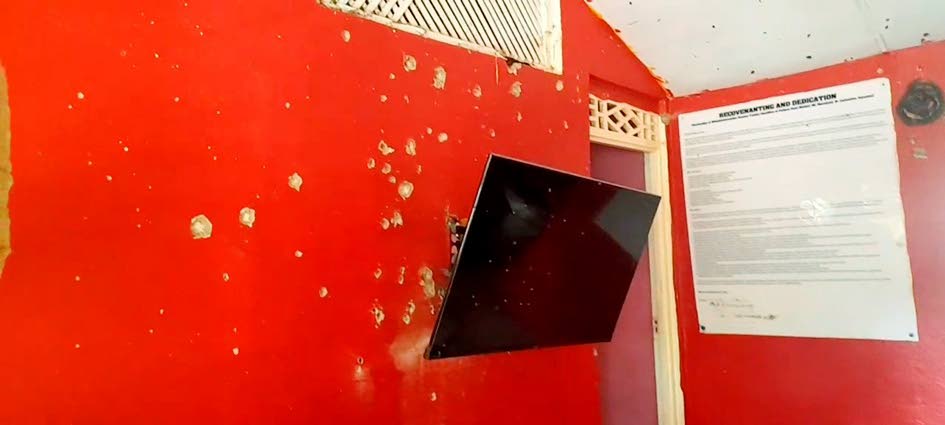 
A bullet-riddled wall inside the house. 