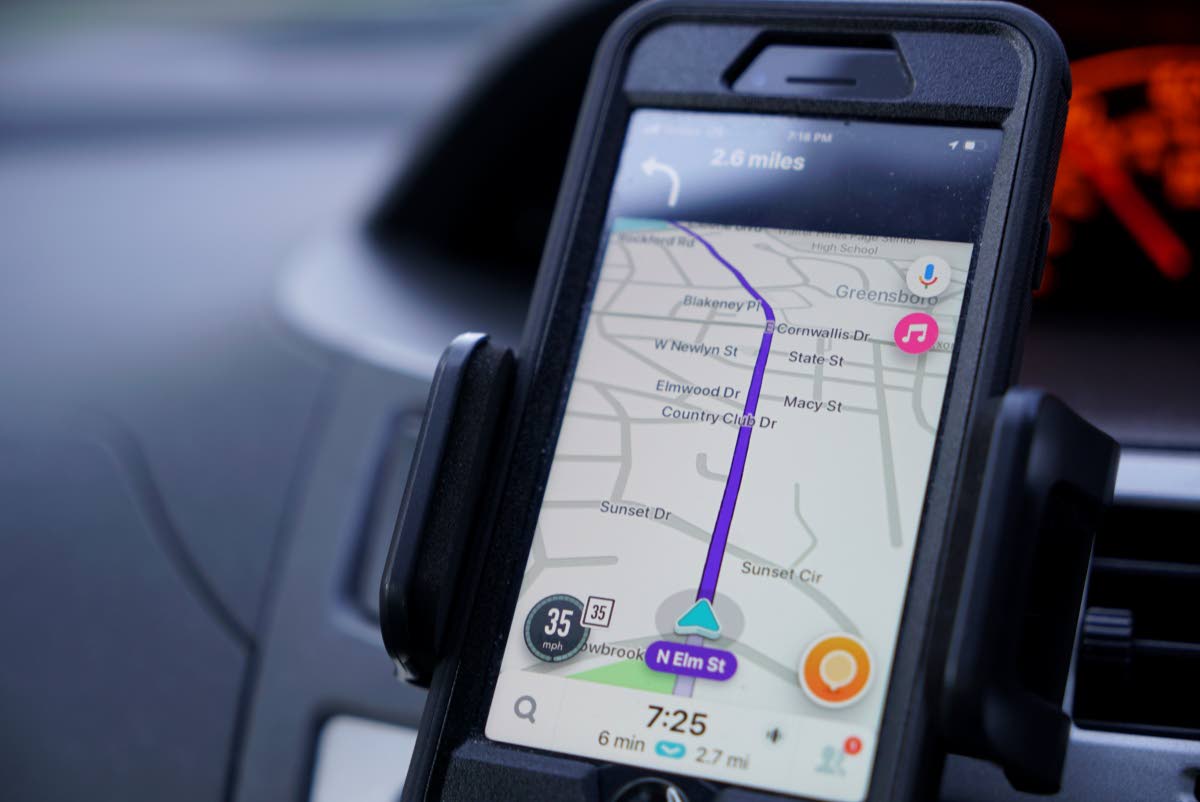 FILE - Former police data analyst Davin Hall uses the Waze navigation app while driving through Greensboro, N.C., on Wednesday, June 22, 2022. (AP Photo/Allen G. Breed, File)