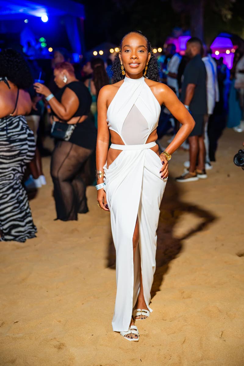 Accountant Trayce Henry wears all white with a little extra in a cutout halter maxi dress.