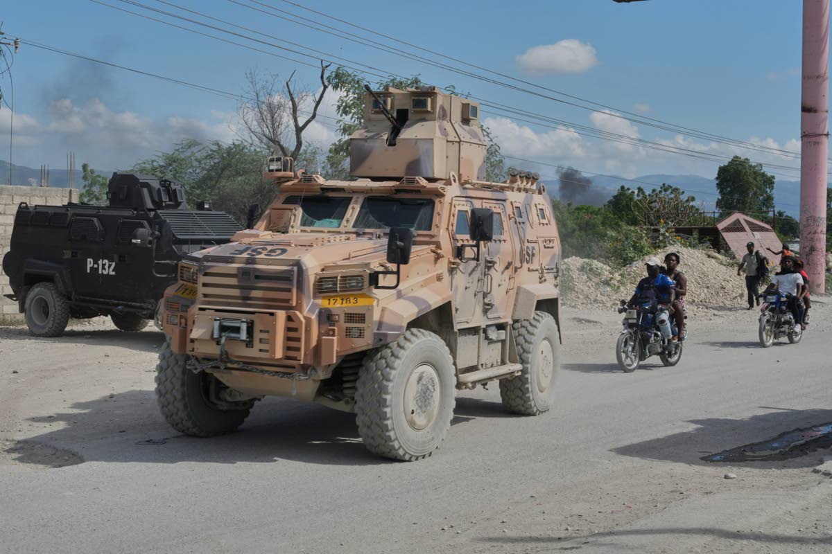 Armoured police vehicles that are part of the Gang Suppression Force (GSF) patrol the Tabarre neighbourhood of Port-au-Prince, Haiti on Monday.