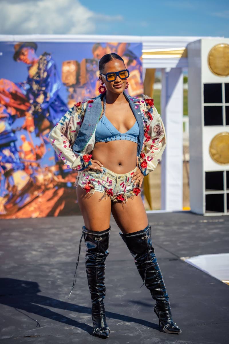 Nikima Sibblies models Biggie’s rose-diamond-denim creation, featuring a bejewelled bra, shorts and jacket. 