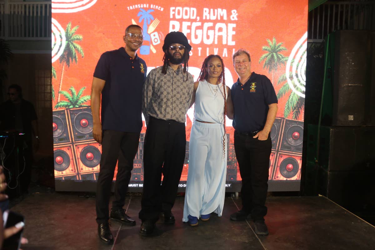 Posing for the camera at the launch of the Treasure Beach Food, Rum and Reggae Festival on Tuesday at 10A West Kings House Road in St Andrew are (from left) festival co-director Gregory Wright, reggae artistes Protoje and Lila Iké and co-director Jason He