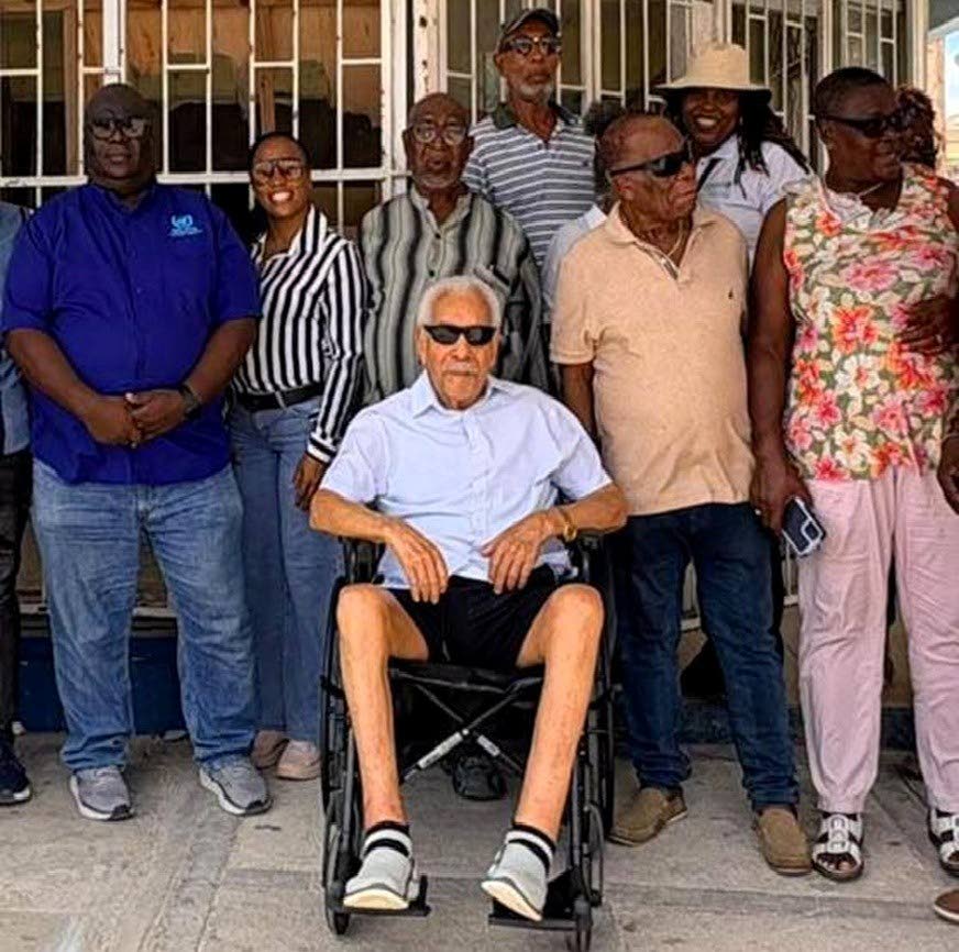 From left: Dennis Zulu (UN Regional Coordinator), Kadian Myers-Brown (President of the Chamber of Commerce), Amb. Byron Blake, Junor Farquharson (Chick’s Bar), Fern Spencer (partly hidden), Trevor Hamilton, Elaine Clemmings (in hat, business totally was