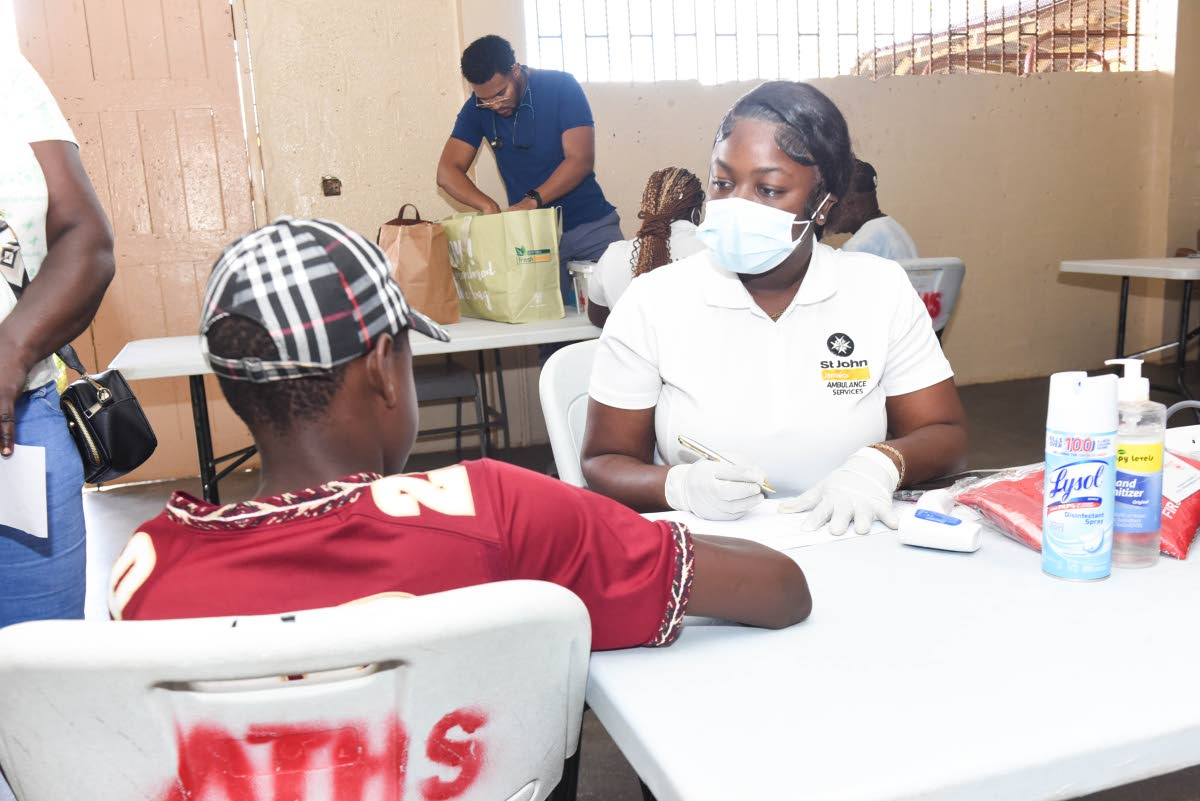 A boy in Albert Town, Trelawny receives a checkup by a St John Ambulance Jamaica medical volunteer in this November 2025 photo as Hurricane Melissa survivors of the rural community attempt to reassemble their lives following the hurricane’s landfall on O