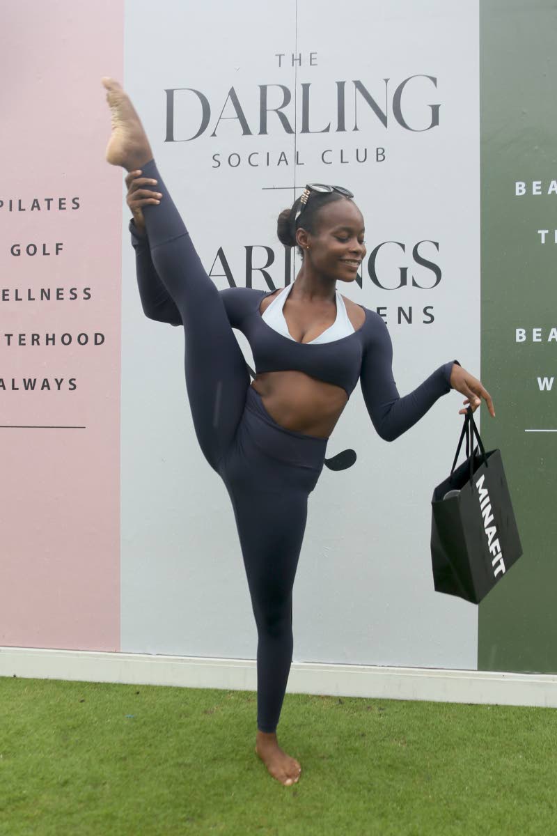 Centre: Zinzi-Akili Duhaney, a dance student at The Company Dance Theatre, shows her flexibility while wearing an outfit from MINAFIT during Darlings on the Greens, held on Sunday. 