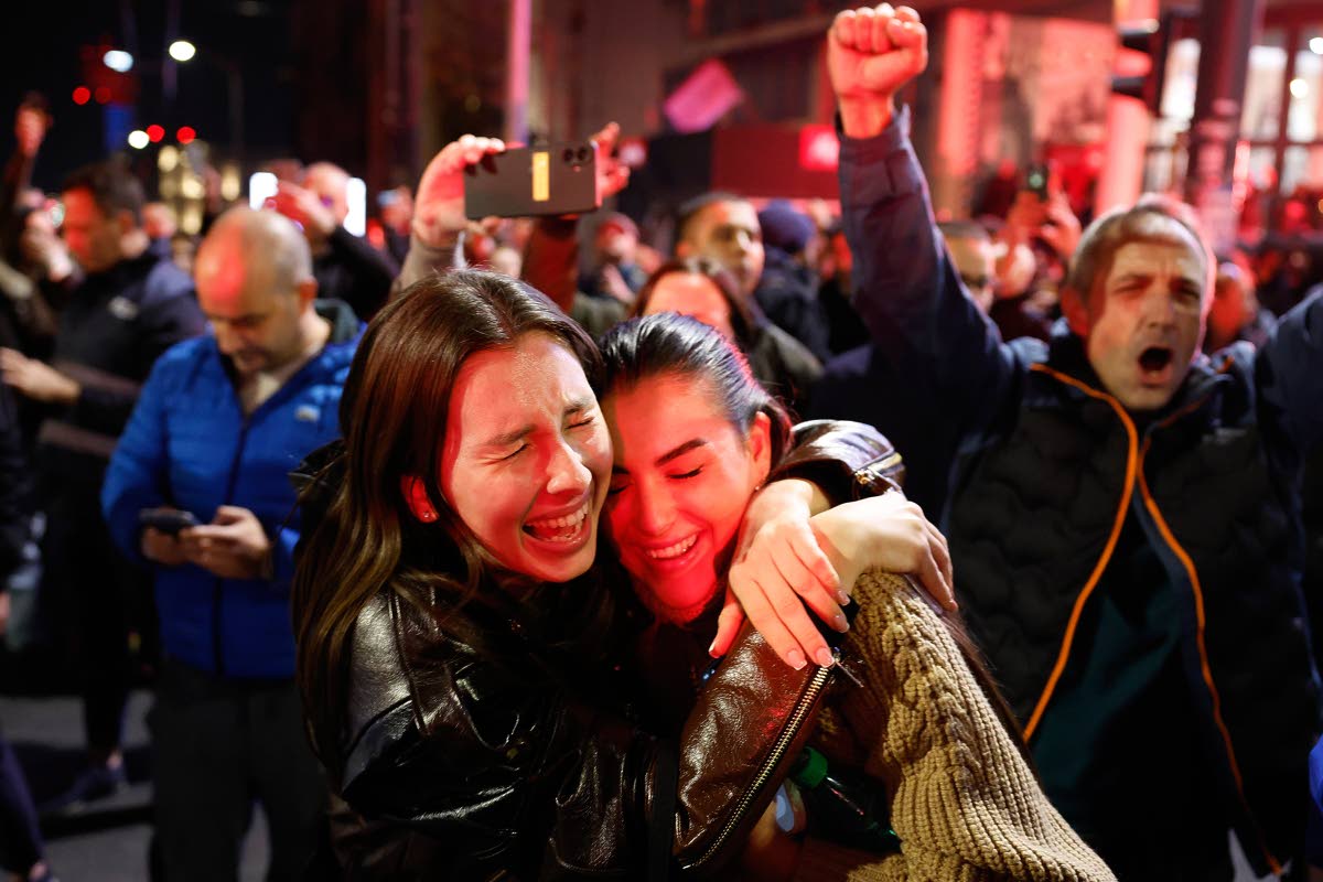 People celebrate after Aleksandar Vucic, leader of the right-wing Serbian Progressive Party (SNS) conceded defeat in the parliamentary election in Belgrade, Serbia.