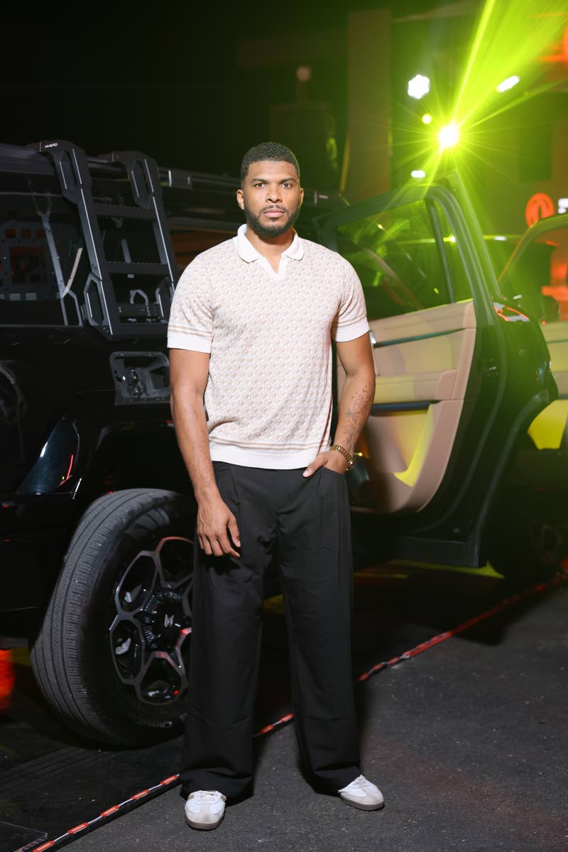 Kavouhn Lewars-Smith, founder and chief executive officer of Kinematix Studios, stands tall and trendy with the Dongfeng M-HERO.
