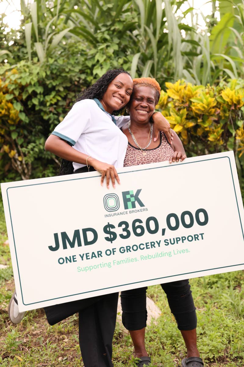 Renee Moncrieffe (left), head of marketing at Fraser Fontaine & Kong Ltd, presents a grocery voucher cheque to Rosalind Gooden in Bethel Town, Westmoreland, on Thursday, October 22,  as part of the FFK Cares Home Again initiative.