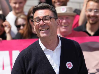  Andy Burnham, Britain’s Labour candidate for Makerfield, speaks in front of supporters during the by-election in Makerfield, England, Thursday, June 18.