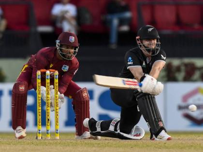 West Indies captain and wicketkeeper, Shai Hope, looks on as New Zealand batsman, Tom Latham, plays a reverse sweep during a One-Day International.  