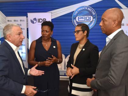 President of the Private Sector Organisation of Jamaica (PSOJ), Metry Seaga (left), converses with from (second left) Executive Director of the PSOJ, Sacha Vaccianna-Riley; Deputy Managing Director, Jamaica National (JN) Bank, Gillian Hyde, and Managing Di