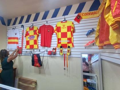 Michelle Sterling, bursar at Cornwall College, inspects the merchandise following the launch of Cornwall College’s Memorabilia and More store.