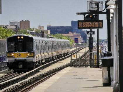 An Atlantic Terminal bound LIRR train arrives at the Nostrand Avenue station, July 9, 2017, in New York. 

