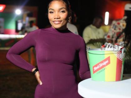 Taura Cammock, chief executive officer of Eyes by Taura, is plum perfection in a curve-hugging bodysuit.