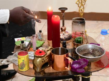 This file photo shows an Obeahman performing rituals.