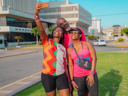 Say cheese! From left: Charlette Rowe, commercials operations manager, Carlos Watson, machine technician, and Noelle Brown of the Lymers Run Club, snap a selfie to mark the finish.