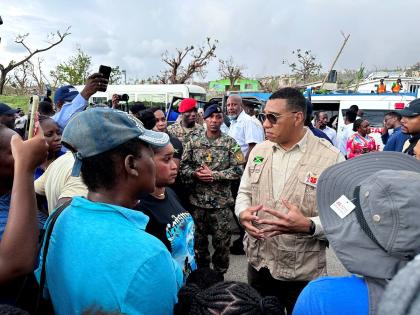 Prime Minister Dr Andrew Holness, interacts with residents of Whitehouse, Westmoreland, during a tour with regional and Jamaican leaders to areas that were badly hit by Hurricane Melissa.