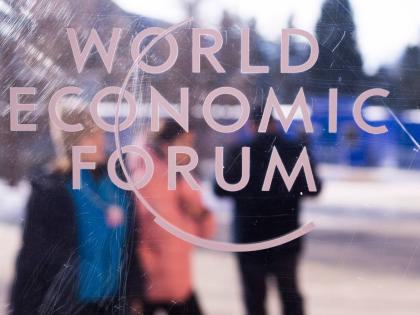 The logo of the World Economy Forum is displayed on a window of the Congress Centre where the Annual Meeting Forum take place in Davos, Switzerland, Sunday, January, 18, 2026. (AP Photo)