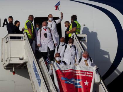 Cuban doctors arrive at the Jose Marti International Airport in Havana, Cuba, June 8, 2020. (Ismael Francisco/Pool via AP, File)