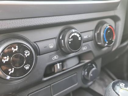 The instrument cluster features a clear, high-contrast temperature gauge alongside vital engine data, ensuring the 4JJ3 powerplant is operating within its optimal thermal range during heavy towing.