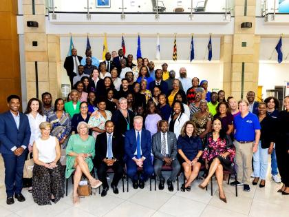 Agriculture Minister Floyd Green (seated, third right); US Chargé d’Affaires Scott Renner (centre); and US Ambassador N. Nick Perry (seated, third left) pose with representatives of American Friends of Jamaica and grant recipients at the 2026 AFJ Annual