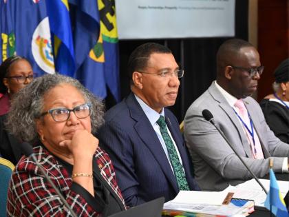 Prime Minister Dr Andrew Holness (centre); Dr Carla Barnett (left), secretary general of the Caribbean Community (CARICOM);  and Dr Amstrong Alexis, deputy secretary general of CARICOM, during a Plenary Business Session at the 49th Regular Meeting of the C