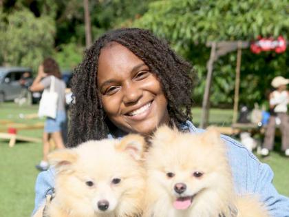 Double the fun, double the fluff as Talitha Thomas poses with her Pomeranian–Shih Tzu mix pups, Luna (left) and Sirius.