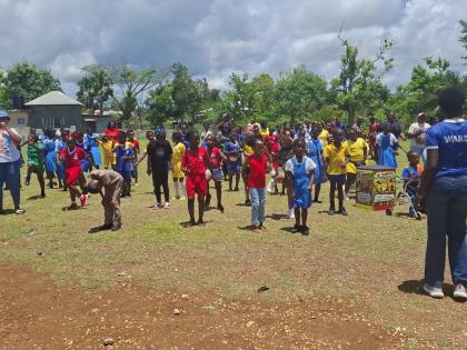 Students start off the morning with a quick but fun warm-up session chanting ‘I love me’, a catchphrase from a Jamaica Moves song.