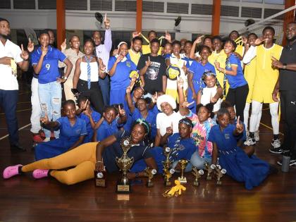 Members of Papine High School celebrate after defeating Oracabessa High in the final of the ISSA All-Island Volleyball competition at the G.C. Foster College yesterday.
