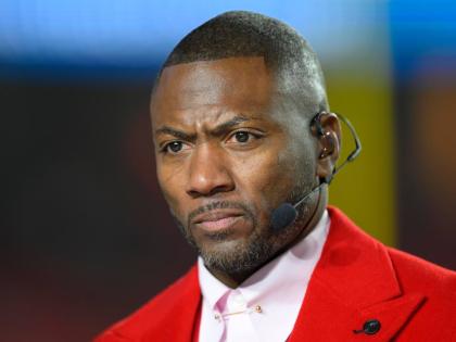 FILE – ESPN Monday Night Football Countdown commentator Ryan Clark looks to the cameras during warmups before an NFL football game between the Kansas City Chiefs and the Washington Commanders, Oct. 27, 2025 in Kansas City, Missouri. 