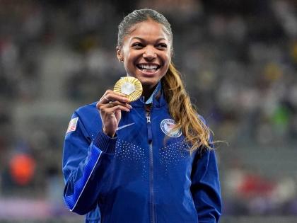 AP 
Gold medallist Gabby Thomas stands on the podium after the women’s 200 metres at the 2024 Summer Olympics, Wednesday, August 7, 2024, in Saint-Denis, France. 