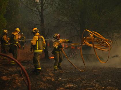 Firefighters from Paris battle a wildfire near Marcheprime, outside, Bordeaux, France.