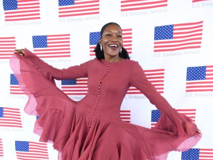 Tishauna Mullings, chief social innovator at NexxStepp, wears a flared-sleeve mini dress with a ruffled hem from Rose’s Couture.