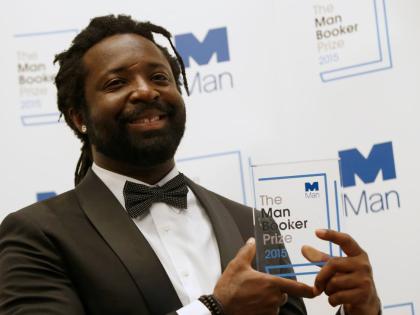 Marlon James poses with the Man Booker Prize after his book ‘A Brief History of Seven Killings’ was named as winner of the 2015 Booker Prize 2015 for Fiction, following the award ceremony at the Guildhall in London on October 13, 2015.