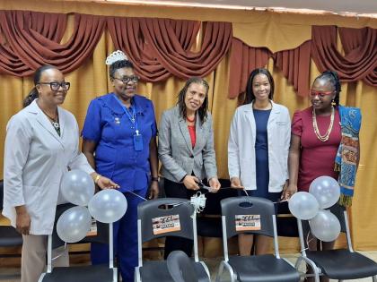Jamalco’s Manager, Corporate Communications and Public Relations, Donna Marie Brooks (third from left), presents donated chairs to the Accident and Emergency (A&E) Department of the May Pen Hospital, to representatives of the May Pen Hospital. Pictured f