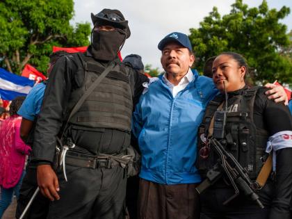  Nicaraguan police have their picture taken with President Daniel Ortega, in Masaya, Nicaragua.