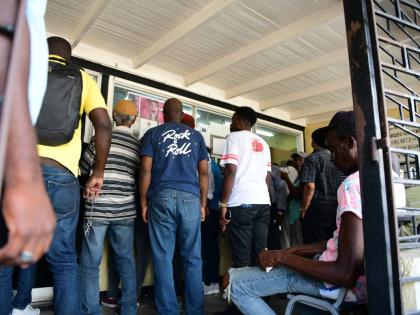 Persons at the Spanish Town Road Examination Depot in Kingston.