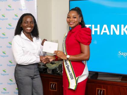 Shanique Sommerville, Miss Westmoreland Festival Queen 2026 (right), receives a cash voucher to start a Sagicor Bank Jamaica savings account from Kerry-Ann Brainsford, manager, commissioned sales, Sagicor Bank, during the Financial Literacy Training Sessio