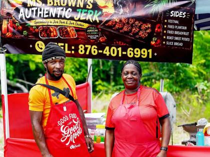 Marilyn Brown (left), of Ms Brown’s Authentic Jerk, who placed third in the Walkerswood Jerk Competition, is joined by her assistant, Tashane Lynch.