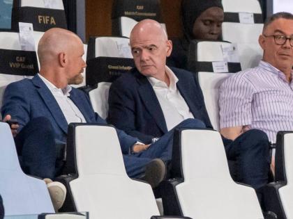FIFA president Gianni Infantino (centre)  speaks to secretary general Mattias Grafstrom (left), while sitting beside president of Moroccan Royal Football Federation Fouzi Lekjaa as they attend a Women’s AFCON 2026 soccer match between Malawi and Zambia, 