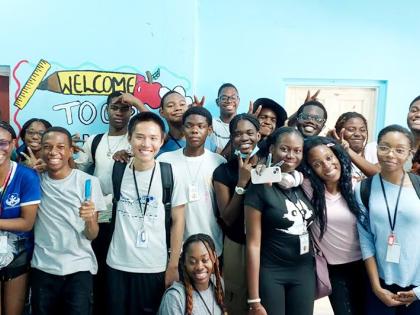 Students of the JamCoders Summer Camp pose for a group photo at the August Town Church of Christ Basic School.