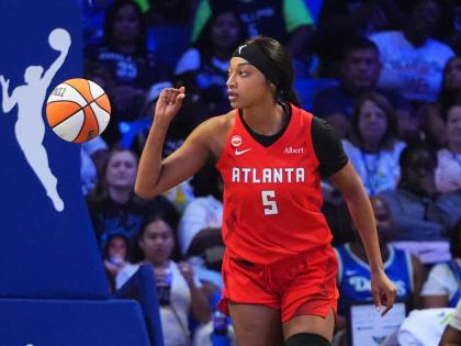 Atlanta Dream forward Angel Reese gestures after scoring a basket during the first half of a WNBA basketball game against the Dallas Wings in Arlington, Texas, Wednesday, July 29, 2026. 