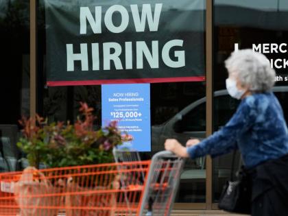 AP 
Hiring sign for sales professionals is displayed at a store, in Vernon Hills, Ill., Wednesday, April 15, 2026. 