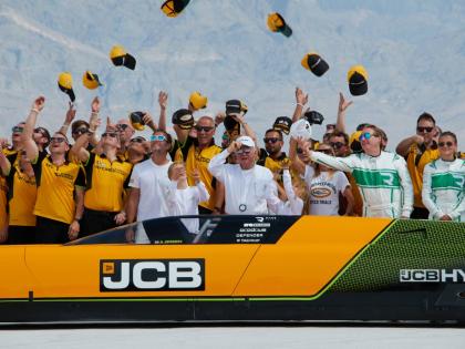 British driver Andy Green (centre) and the JCB engineering team celebrate setting a new land speed record for a hydrogen-powered vehicle at the Bonneville Salt Flats in Utah, yesterday.